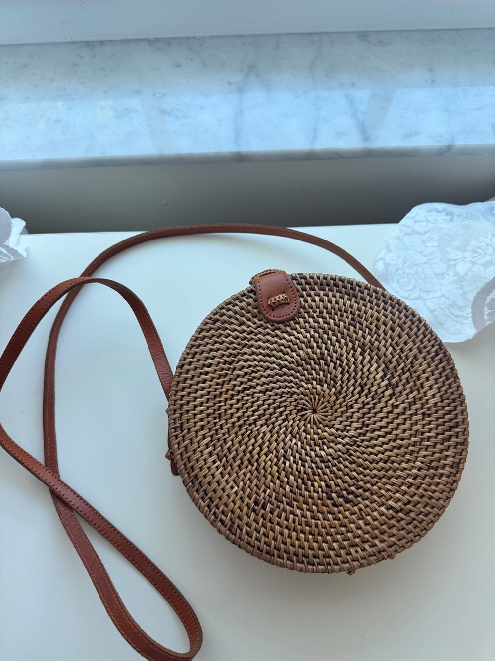 Round Woven Straw Crossbody Bag with Brown Leather Strap